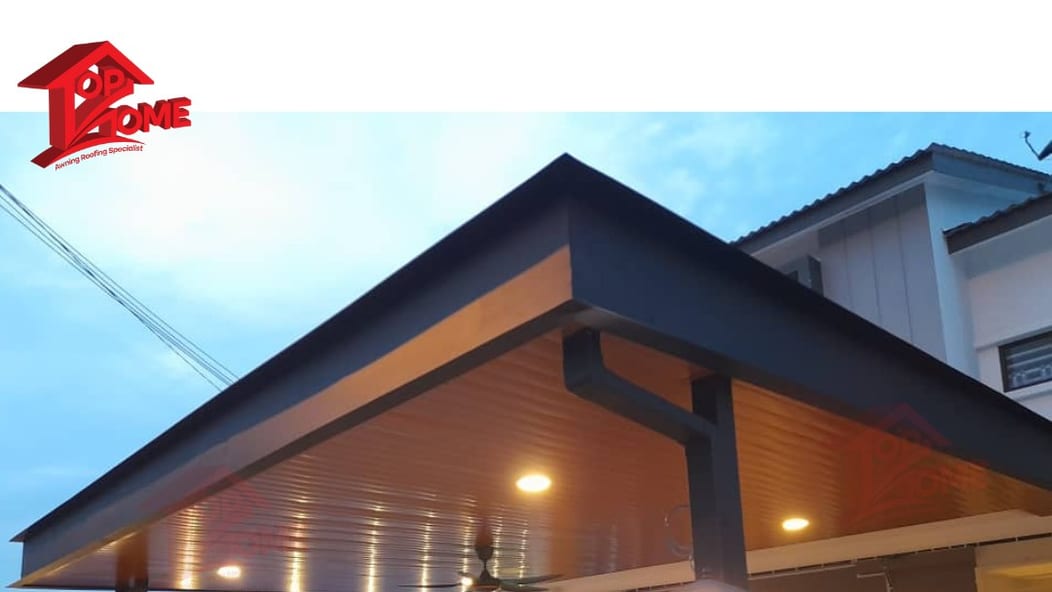 A pitched gable canopy with a wood-grain underside and concealed lighting, over the front of a house at dusk.